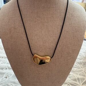 Large Gold Bean Pendant Necklace in Black Cord